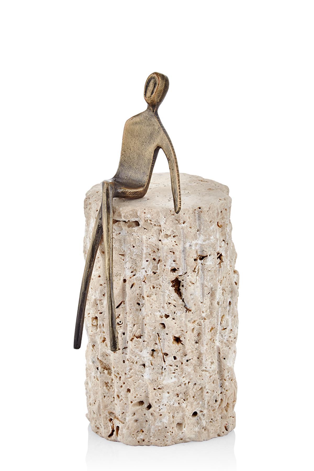 Seated figure on travertine, 10 × 10 × 22 cm